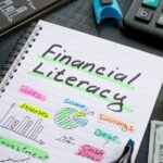 Financial literacy and financial education concept. A Notebook with marks about financial literacy.