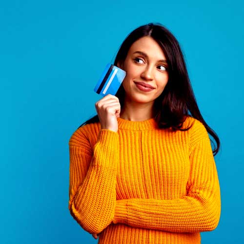 A girl holds a credit card