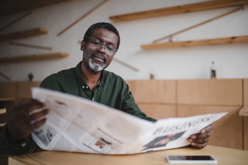 A man reads a newspaper