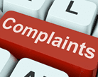 Image of a computer keyboard with a complaints key