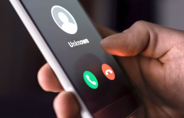 Close up of smart phone receiving a call from an unknown number.