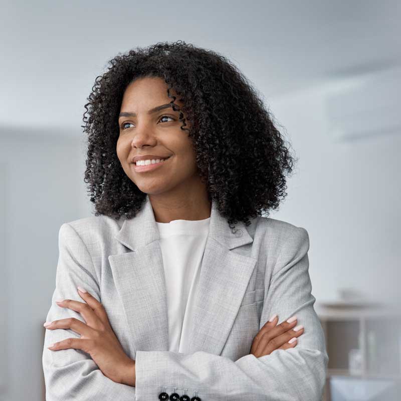 A woman smiles and looks forward