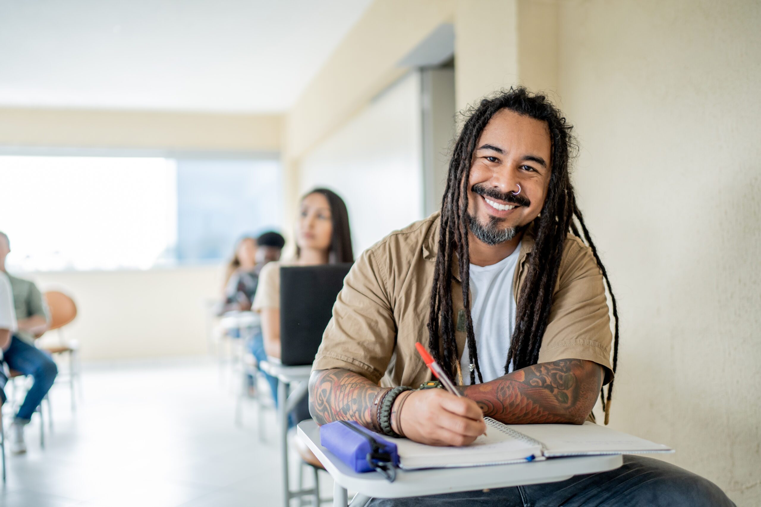 Portrait of smiling mature man in college