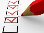 A red pencil and some checkboxes on a paper