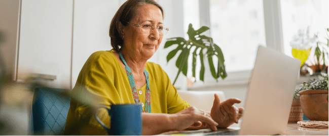 older adult using a laptop